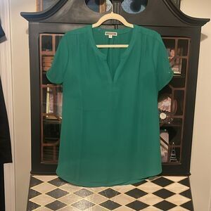 green v-neck blouse